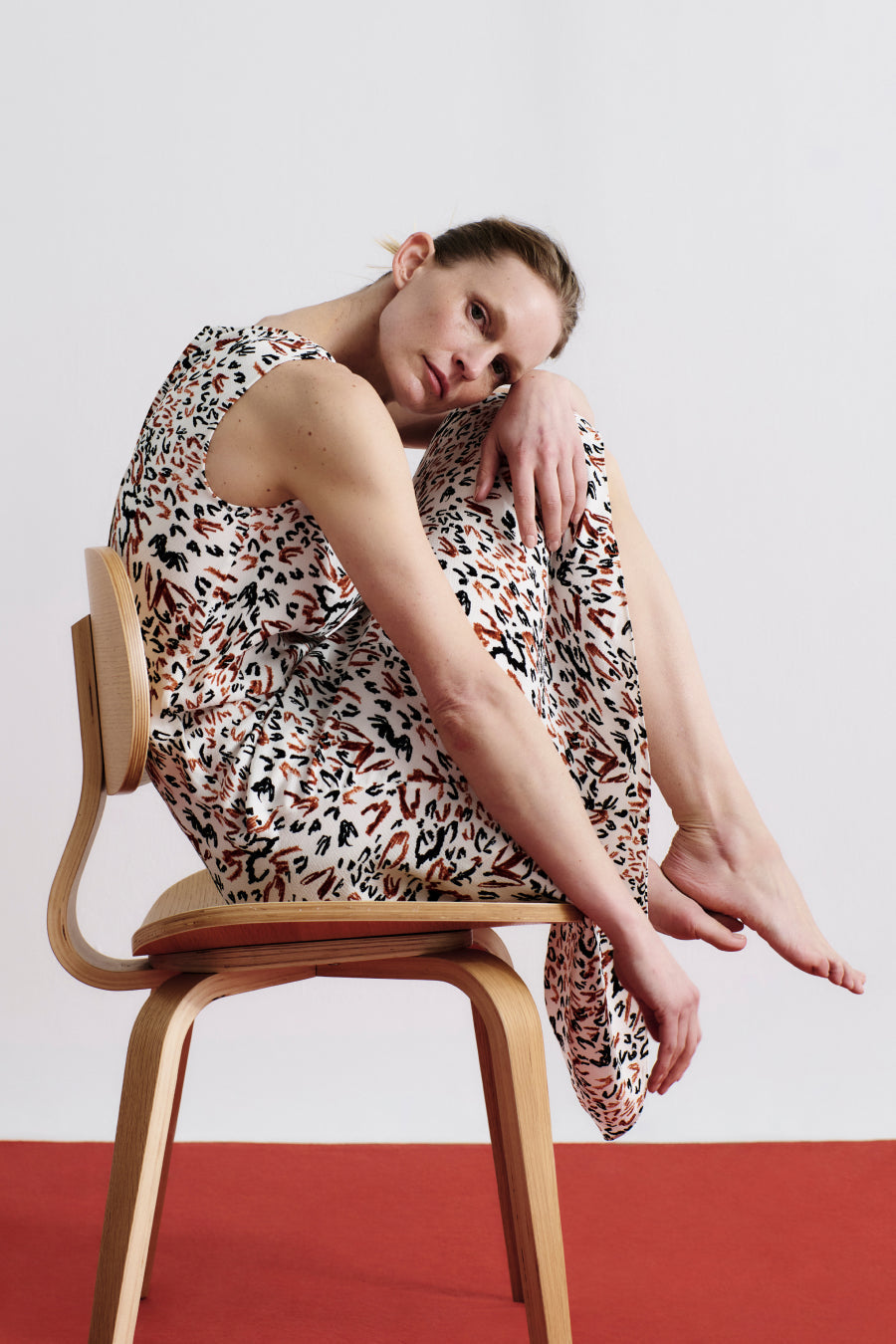 front image of a woman wearing the priya dress in leopard sketch | Exclude