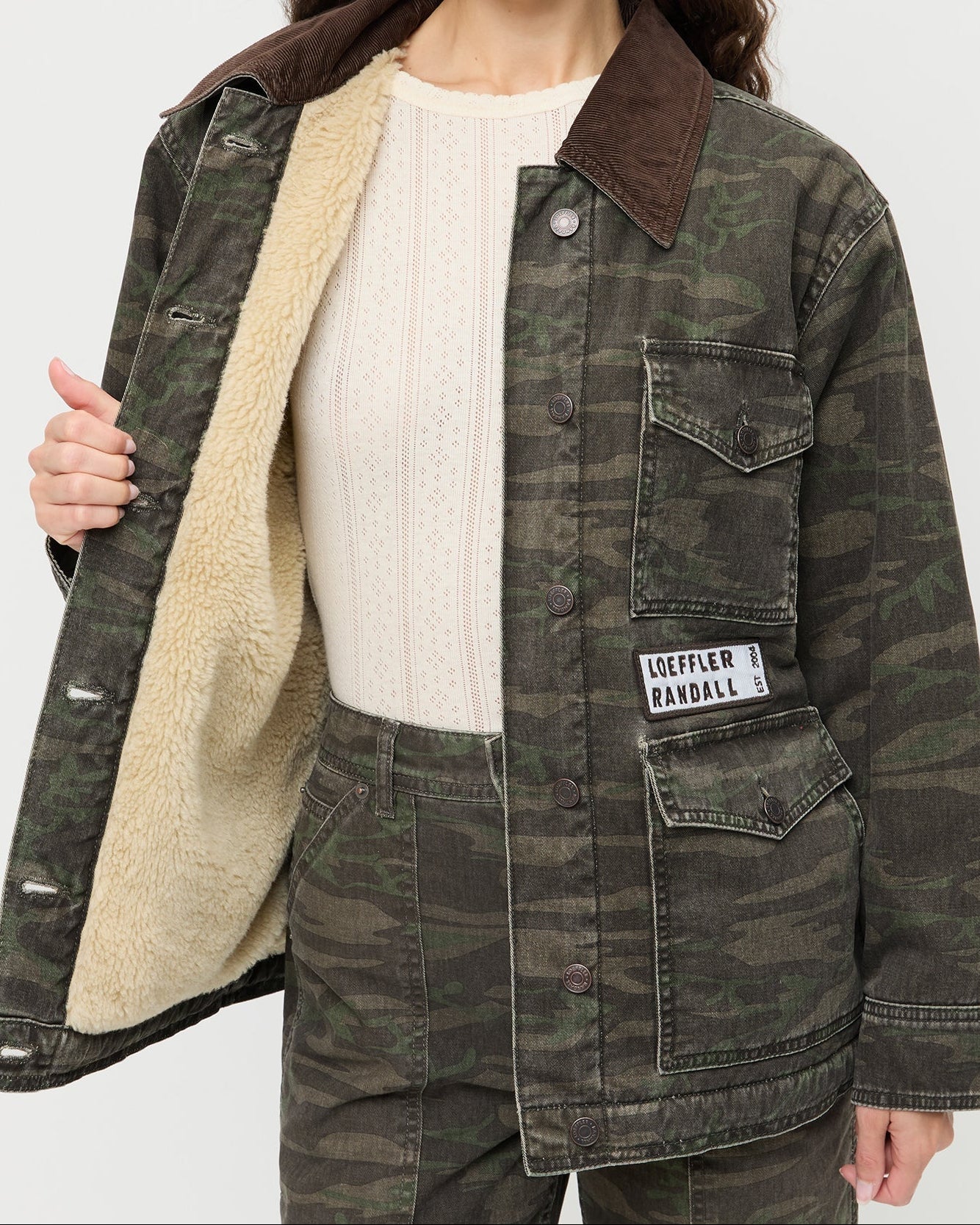 Quincy Jacket in dark camo denim, Molly Workwear Jean in dark camo denim, and Lolo Pointelle Long-Sleeve Top in cream pointelle.