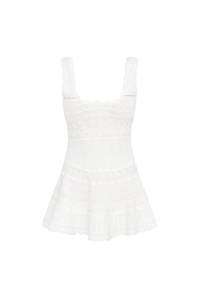Mini dress featuring scallop detail through the stitch and edge. With a little bit of stretch, thereâ€™s cinching at the waist before falling to a full skirt with a scallop trim.