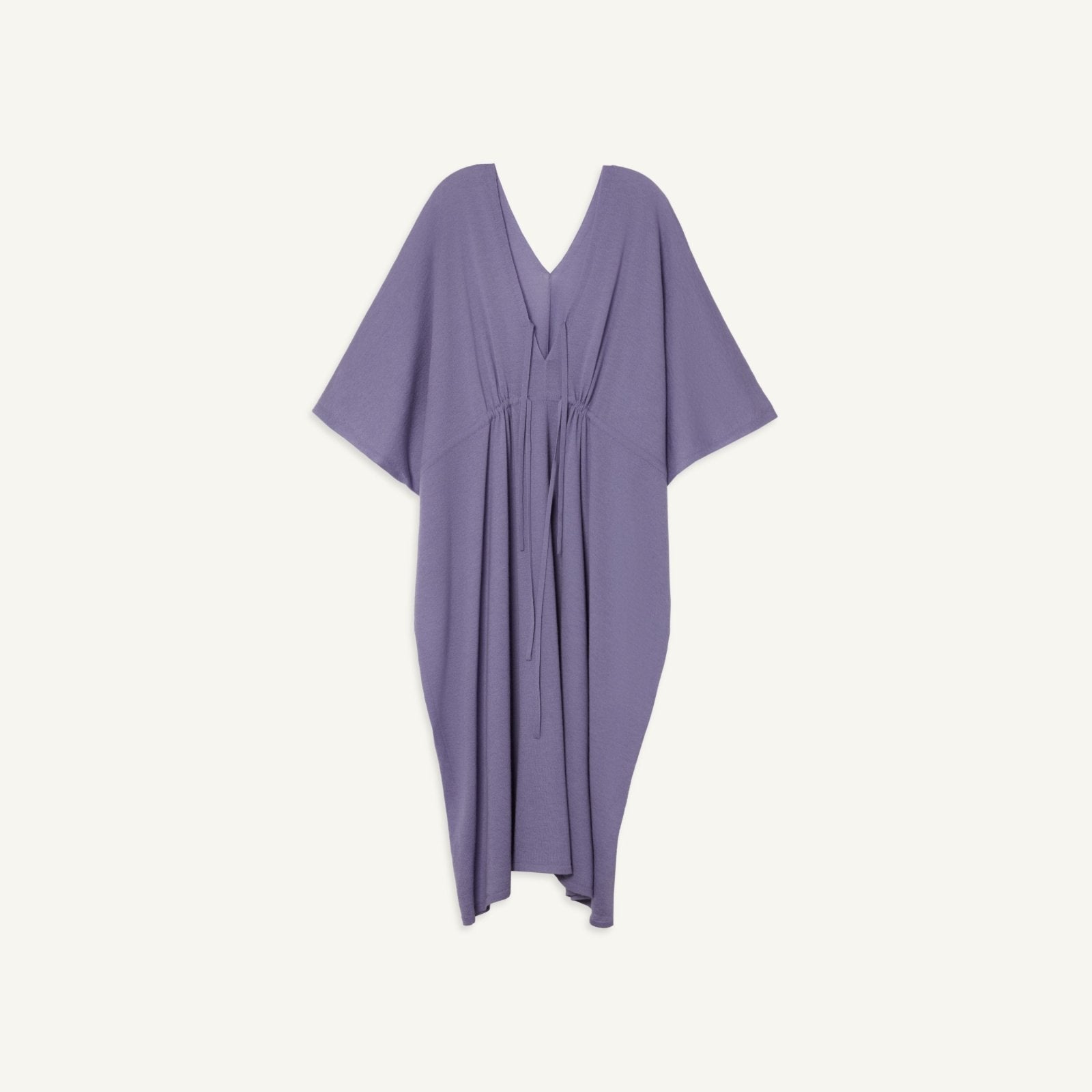 Elegant flowing purple cashmere kaftan with adjustable waist tie and V-neck design.