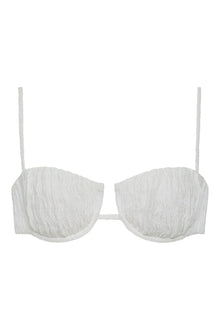 White textured bikini top with petal-shaped cups, thin shoulder straps, and center cutout detail.