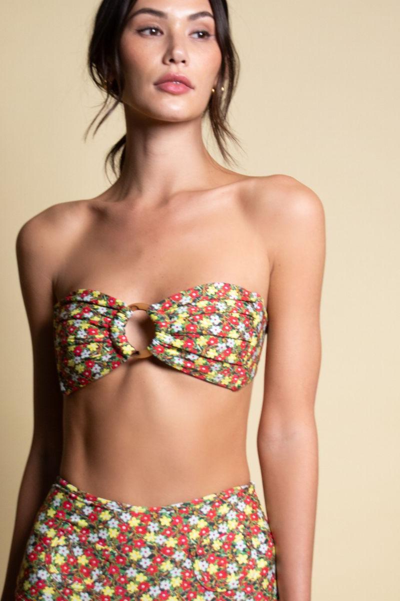 Bandeau bikini top with red, yellow, and white floral print and center ring detail.
