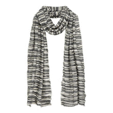 Black and white striped knit scarf with textured slub weave draped loosely around neck.