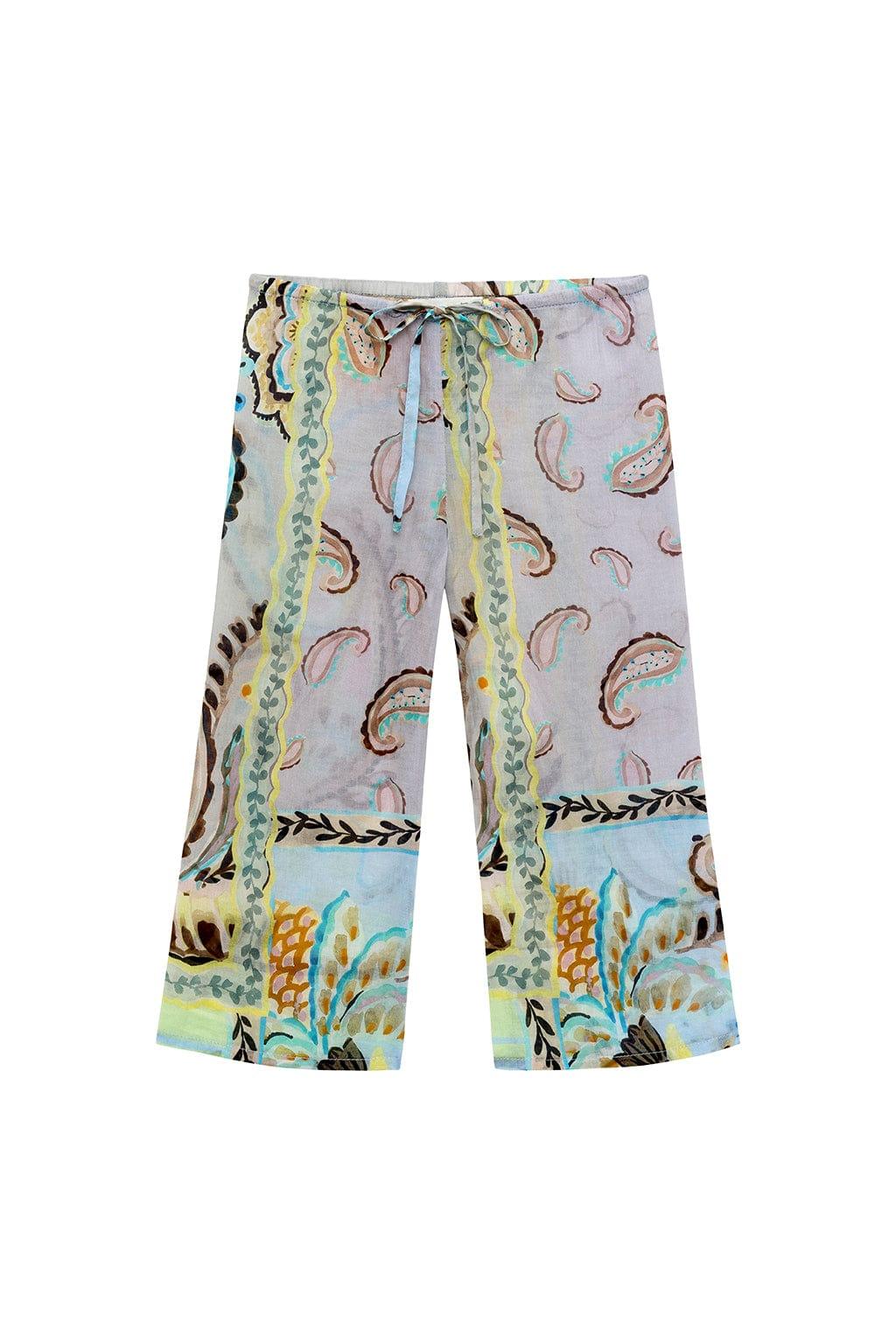 Cropped drawstring pants with multicolored floral and paisley print in shades of blue, yellow, green, and brown.