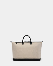 The Rudsak DUBLIN - 9324514 Vanilla is a beige canvas leather unisex tote with black handles, zipper, and base trim, ideal as a weekender bag. Displayed on a plain light gray background.