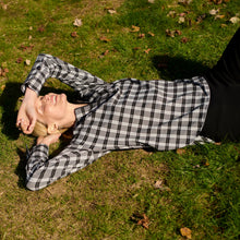 front image of a woman wearing the tully top in checkmate