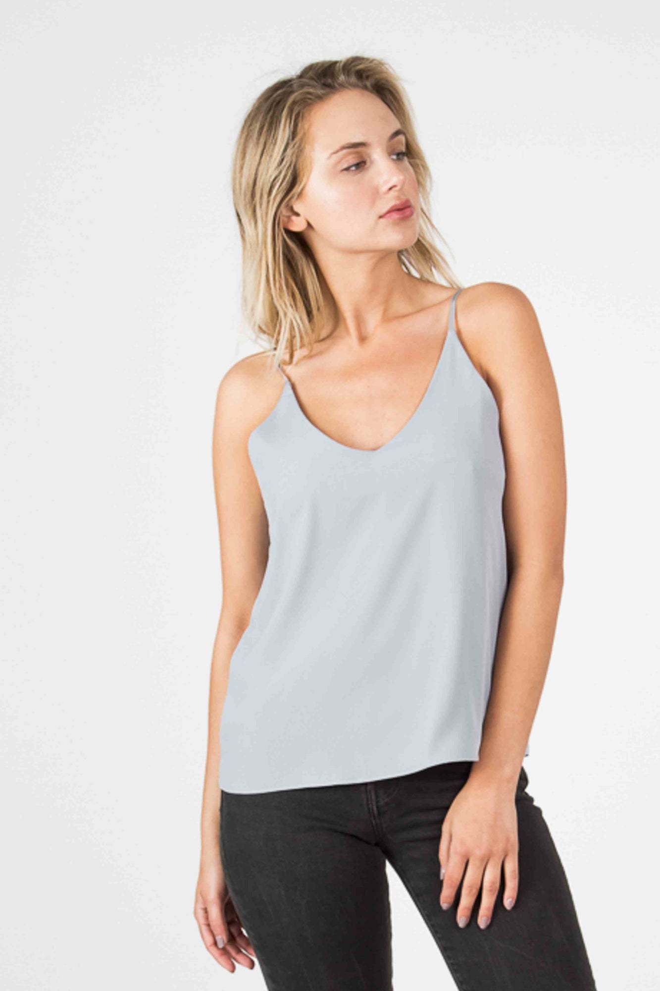 Woman wearing a light blue cami tank top