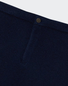 Close-up of the Midnight Jean Mini Skirt showing textured cashmere fabric and classic shank button closure.