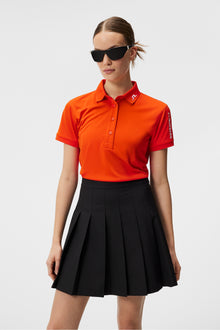 Women | Tour Tech Polo | Tangerine Tango