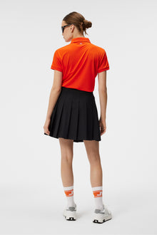 Women | Tour Tech Polo | Tangerine Tango