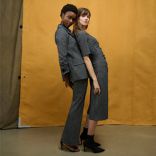 side image of a woman wearing the yiyan jacket in stretch houndstooth