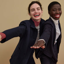 Front image of a woman wearing the yiyan blazer in navy multi