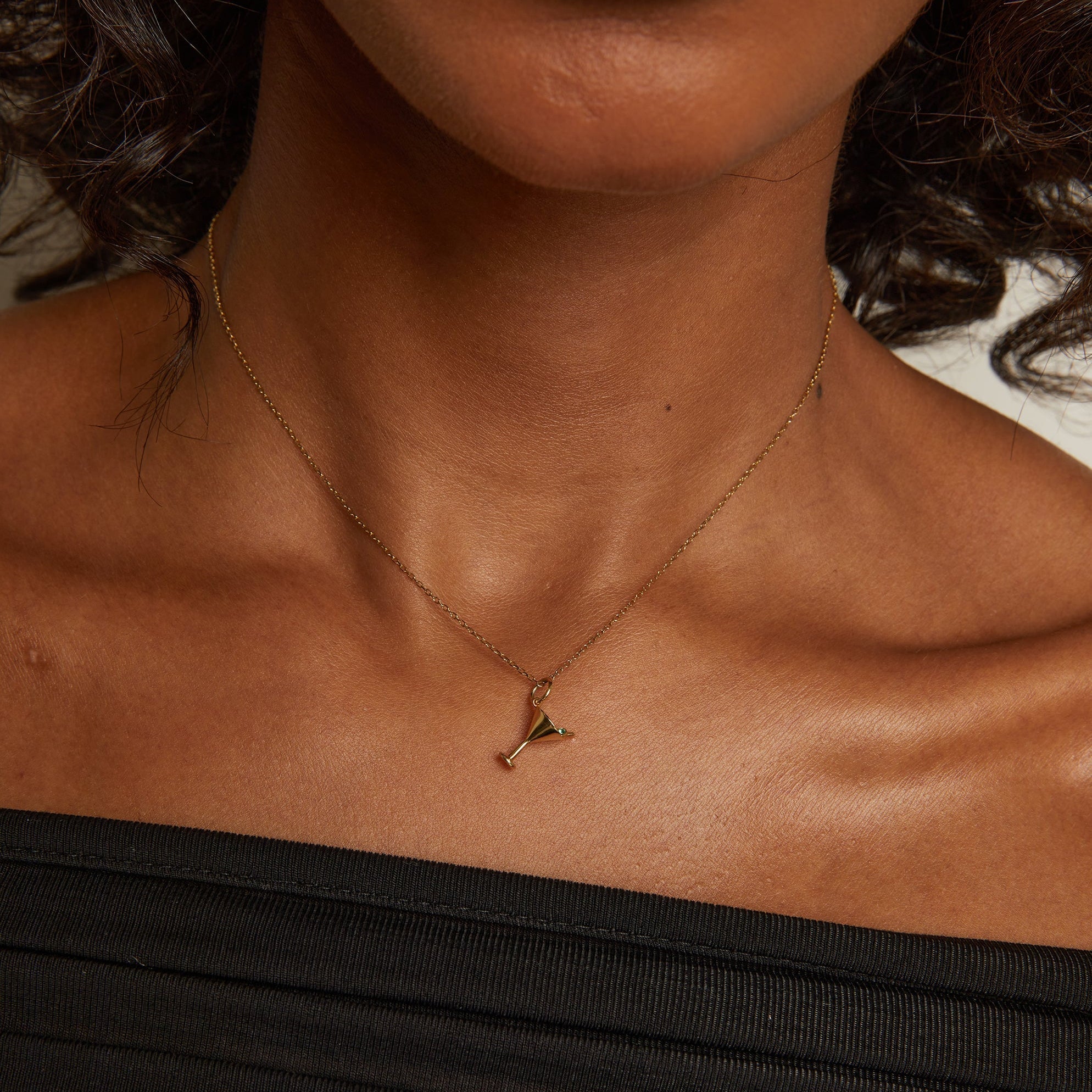 Necklace with a pendant worn by a person