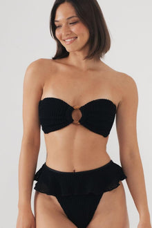 Black crochet bikini bottom with ruffle detailing at the leg openings.