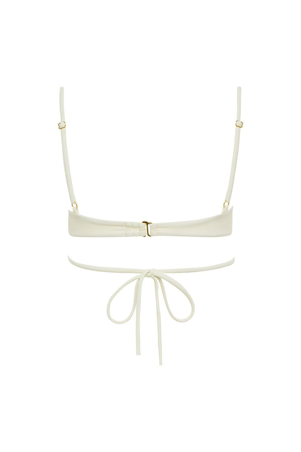 Cream bikini top with adjustable shoulder straps, center buckle closure, and tie-front bottom detail.