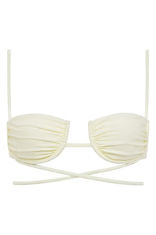 Cream bikini top with ruched cups, thin shoulder straps, and crossover back ties.