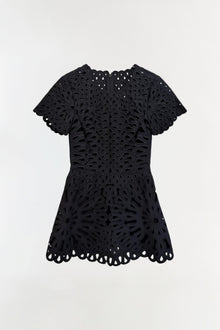 Black mini dress with short puffed sleeves and all-over eyelet embroidery pattern with scalloped hem.