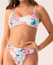 Florencia Smocked Lettuce Edge Bralette Top featuring a scoop neckline, vibrant floral smocked fabric