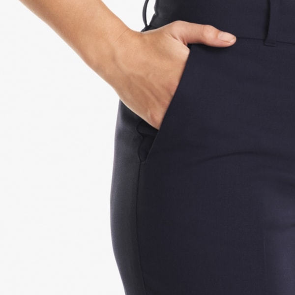 side detail image of a woman standing wearing the Mejia pant in Galaxy Blue | Exclude