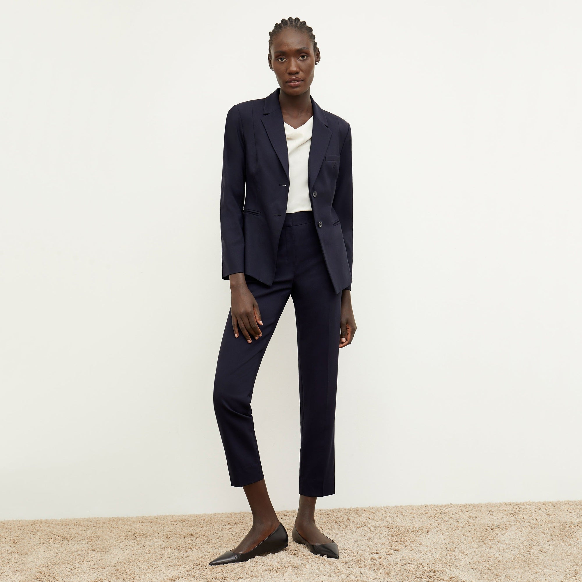 Front image of a woman standing wearing the Mejia pant in Galaxy Blue | Lead