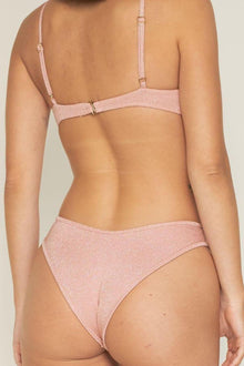 Pink sparkle bikini bottom with high-waisted cut and shimmering fabric, shown from back view.