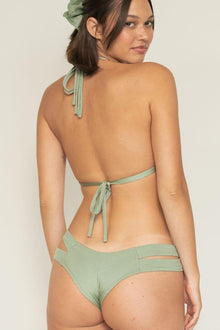 Sage green ribbed bikini bottom with cutout detail on the side and tie closure.
