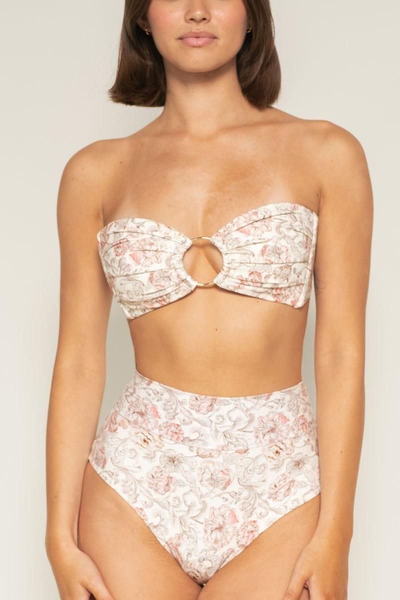 High-rise bikini bottom in cream with pink and taupe floral print, moderate coverage design.