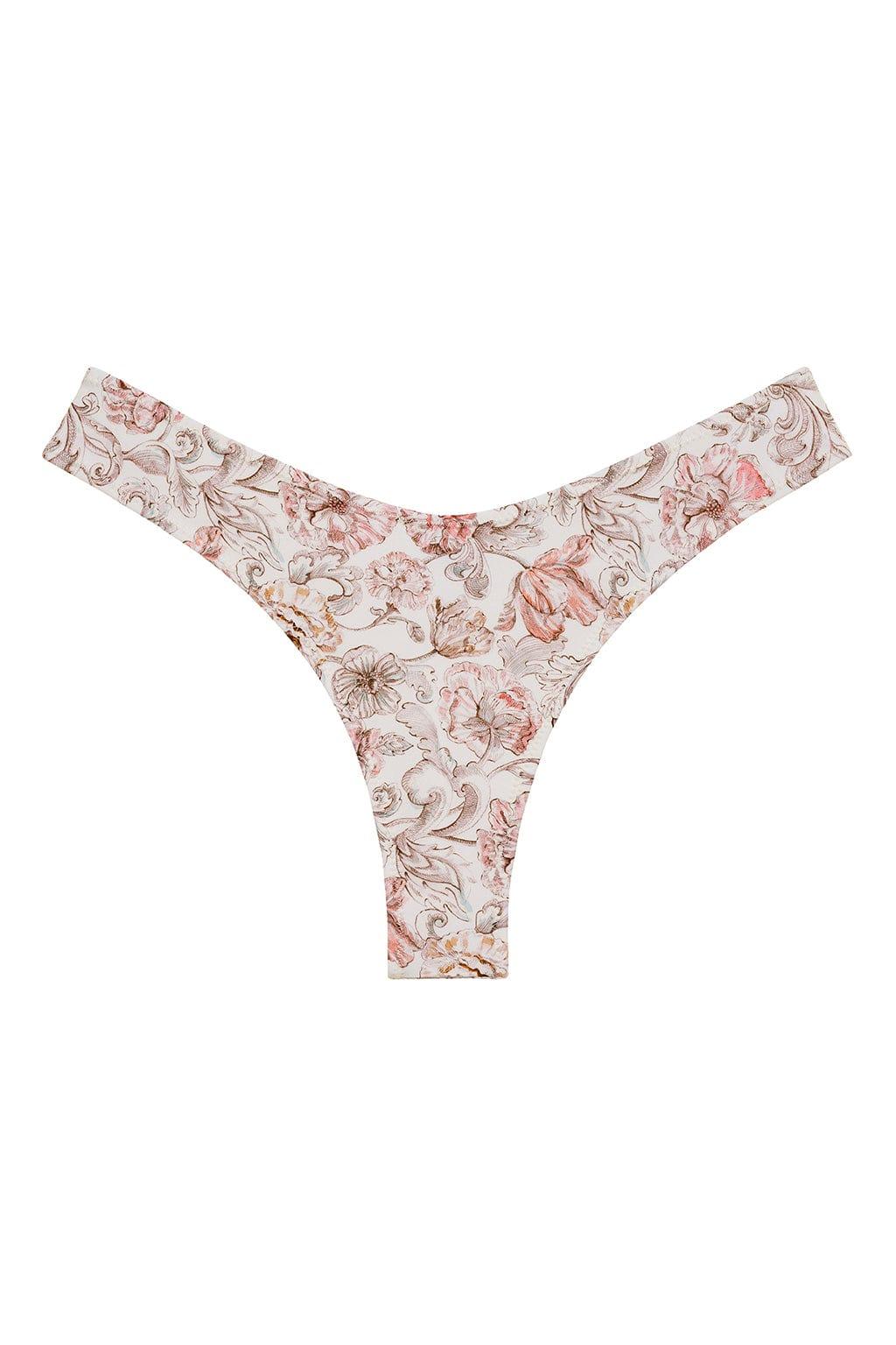 Cream bikini bottom with pink and tan floral print and zig-zag stitching on edges.