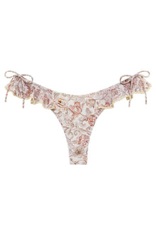 Floral bikini bottom in cream and rose tones with ruffled edges, side ties, and bow details at hips.