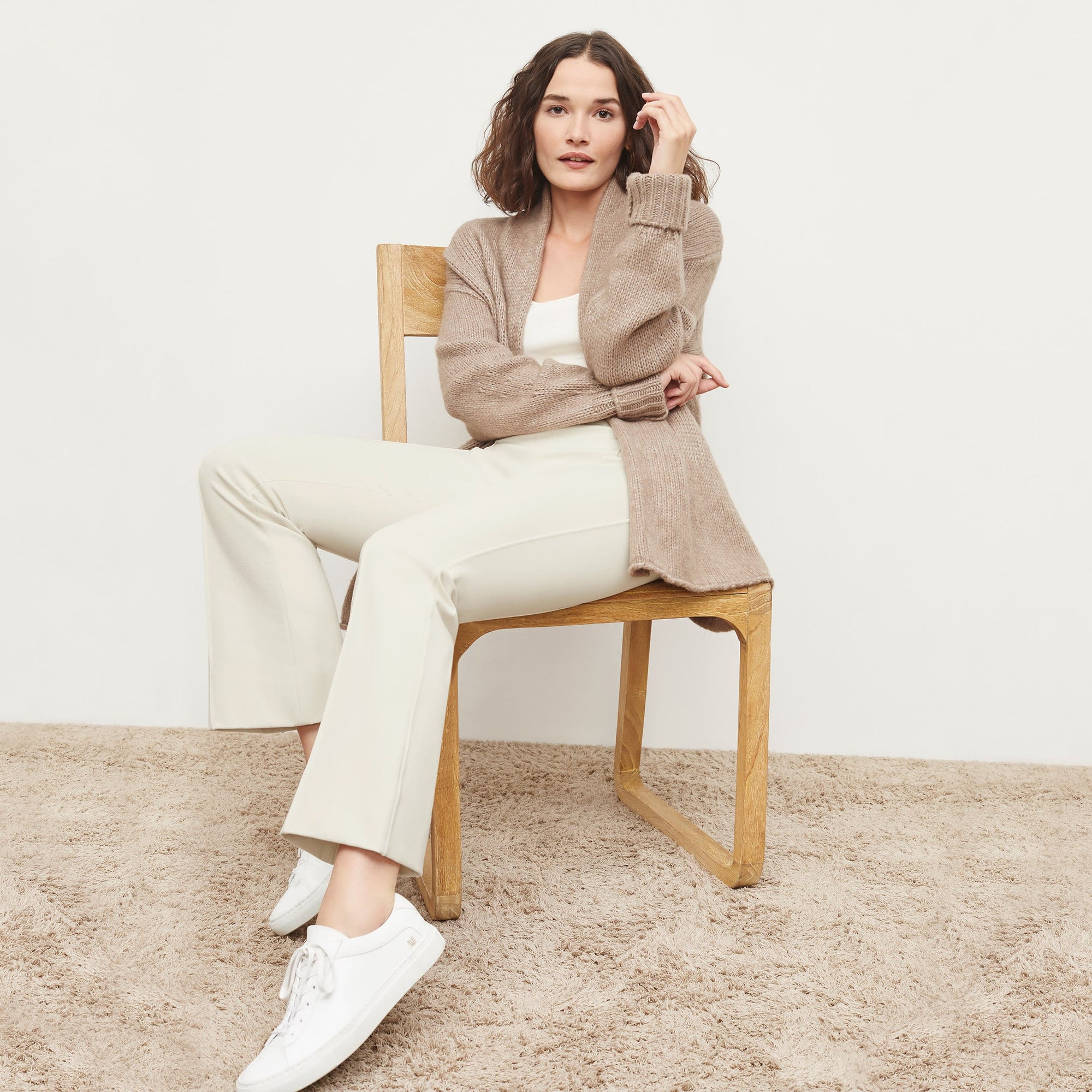 Side image of a woman standing wearing the Shiloh Pant in Pearl
