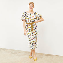 Front image of a woman wearing the Gali dress in meadow print linen