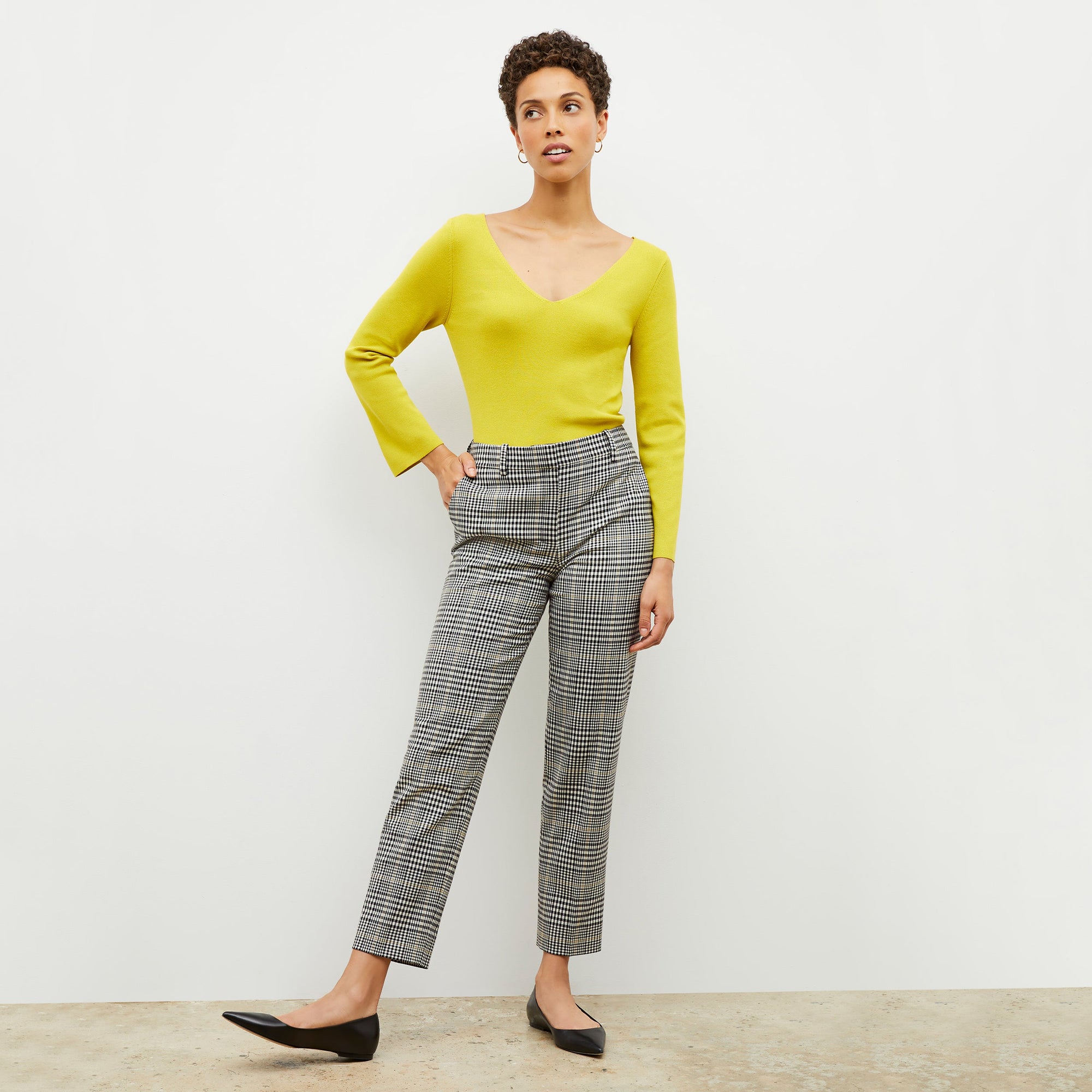 Front image of a woman wearing the kara top in chartreuse