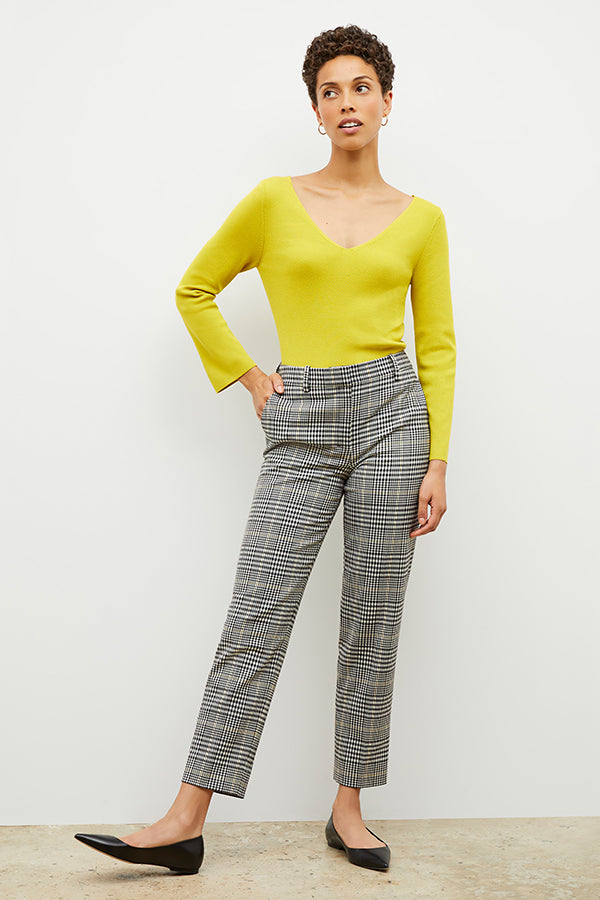 Front image of a woman wearing the kara top in chartreuse | Exclude | Grid Hover
