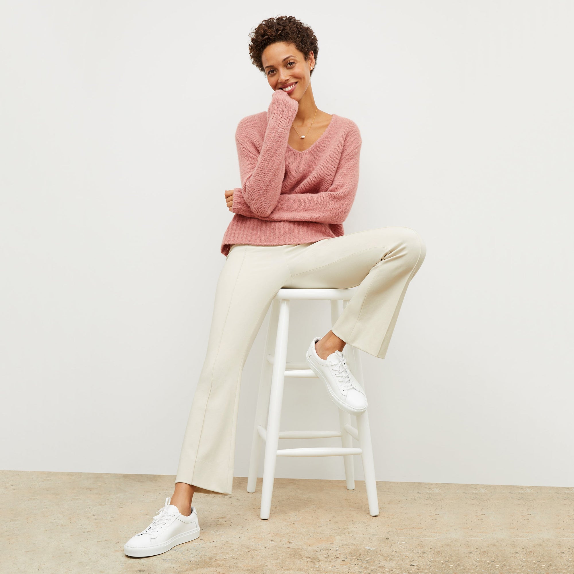 Front image of a woman standing wearing the Shiloh Pant in Pearl | Exclude