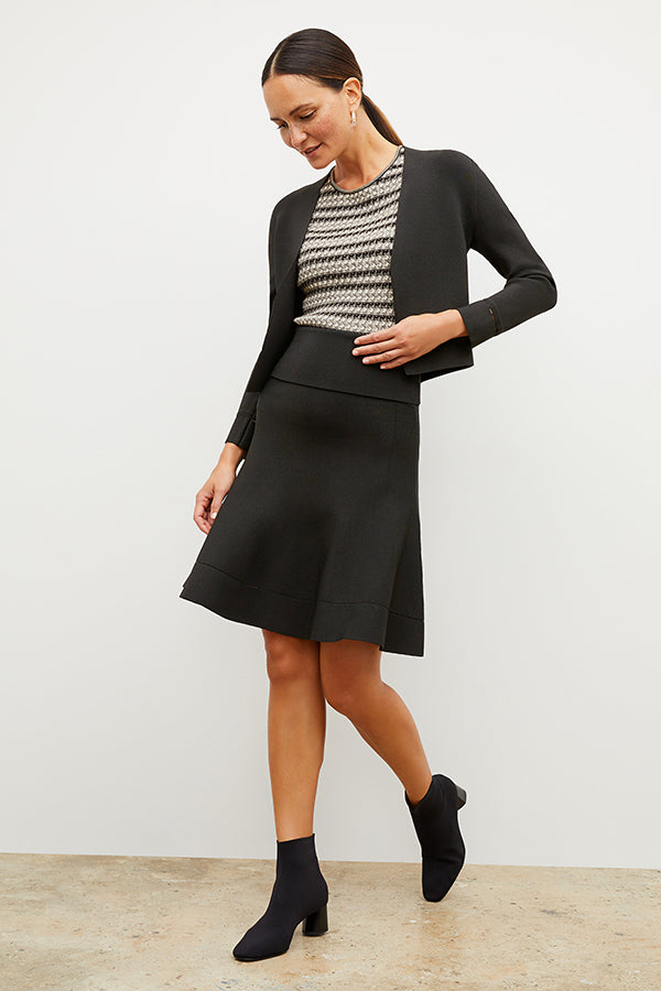 Front image of a woman wearing the luca skirt in black | Exclude