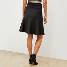 Back image of a woman wearing the luca skirt in black
